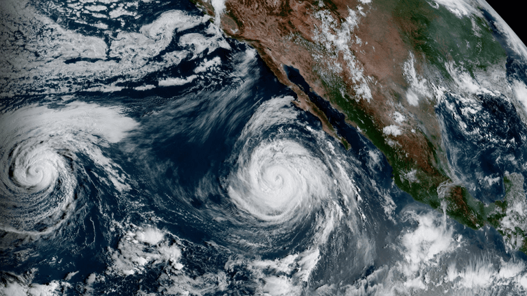 Satellite view of two hurricanes off the coast of Mexico in the Pacific Ocean